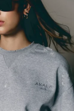 The Akala Studio Distressed Grey Sweater Hot
